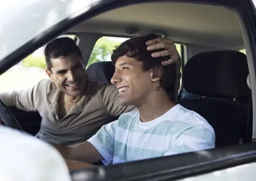 Wiley Insurance Services | Rock Hill, SC | Father teaching teenage son how to drive